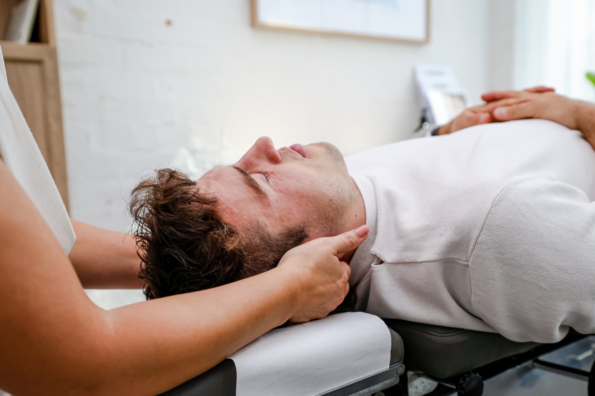 A patient receiving a standard chiropractic adjustment.